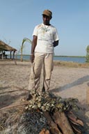 Mamadou, charcoal grilled Oysters, near Elinkine.