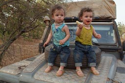 Daniel and David on bonnet of 6x6x Land Rover, southern Senegal.