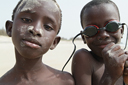 African boys on beach Djembering. African boys on beach Djembering.