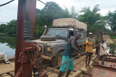 Hand pulled 50 year old ferry, streem in Sierra Leone.