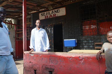 Diallo, Guinean, his Sealand Bar, black walls, Buchanan, Liberia.