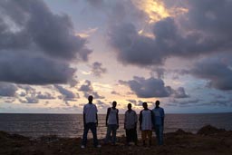 My newfound Ghanian friends, pose in front of sea and sunset, Buchanan, Liberia.