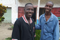 Jonestone and brother Francis, infront of his hotel The Old Place, Buchanan, Liberia.