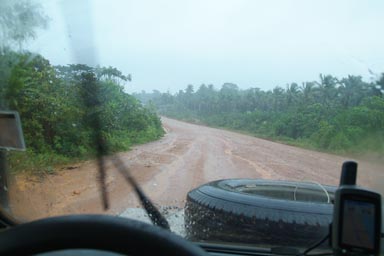 Dirt Road, It rains heavily, picture through wind screen of Land Rover Garmin GPS on dashboard, Buchanan, Liberia.