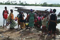 Harper, Maryland, Liberia, African women looking at scars fish catch.