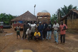 Cold morning, SMD Samuel Mohamed Darwich workers, building the road, village of Gbayan, Liberia.