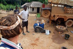 Land Rover jungle repairs, villagers around, road Greeville to Zwedru, Liberia.