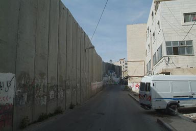 Wall close t0 houses, Palestine.