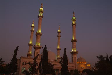 Mosque and church peacefully side by side, at night Aleppo, Syria.