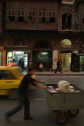 Night, street Aleppo, old wooden house, boy.