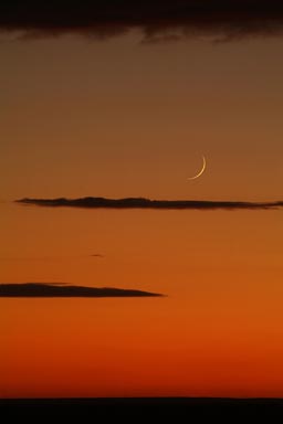 Orange skies, new moon, Syria.