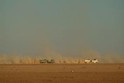 Trucks overtaking, Syria, dirtroad, desert.