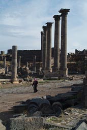 Bosra, Syria, Roman ruins, Muslim woman on decumanus.