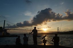 Bosporos, Bosphorous Bridge and Fischer men at sunset.