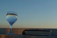 Glass of water, book in Seven Hills Restaurant.