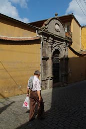 Me walking in front of yellow Ottoman building in Trabzon.