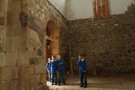 Curious kids in school uniform come see me in Dsolishan church, Turkey.