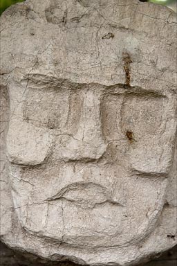 Maya Head/Face in stone, Caracol, Belize..