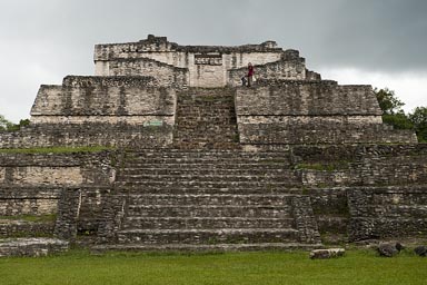 C. and boys on A6 structure, Temple of the Wooden Lintel, Caracol. It starts raining.