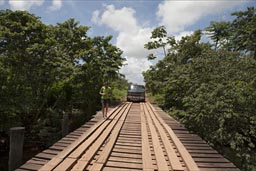 Wooden bridge in Belize on Dangriga road, van and Christina.