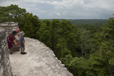 View over jungle, Caana (sky-palace), Caracol. The boys Daniel and David and Christina.