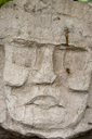 Maya Head/Face in stone, Caracol, Belize..