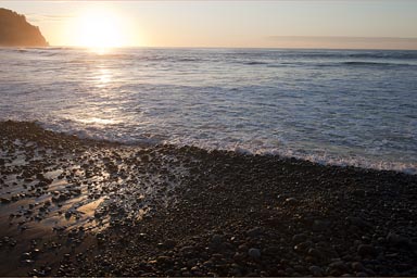 El Zonte, El Salvador, volcanic black pebbles beach.