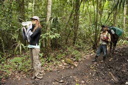 Sip from the water bottle in the jungle on the trail.