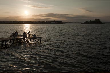 Sunset over pier, Flores, Peten Lake, Guatemala.