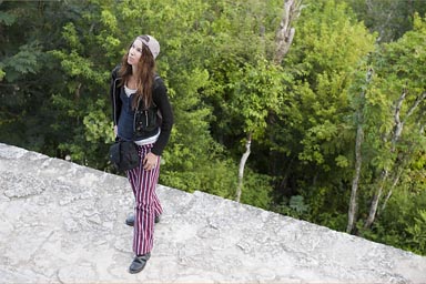 C. and red Todos Santos pants in Tikal on top of Temple 4, Maya Jungle below, Peten Guatemala.