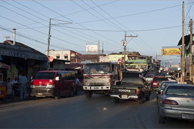 Morning traffic struggles through Rio Dulce/Fronteras town, Guatemala.