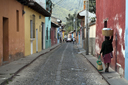 Woman, lone street, Antigua, Guatemala.