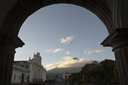 Volcan de Agua, Antigua. Guatemala. A bird flies, morning blue skies, the usual clouds.