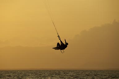 Under an bloody red sky. Kite surfer in air, Punta Chame, Panama.