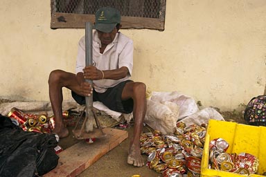 Recycling beer can trash, island of Ustupe, Kuna Yala.