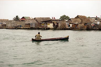 Guna village and dugout canoe in Playa Chico, Guna Yala, Panama.