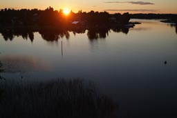 Finland, sunset over lake.