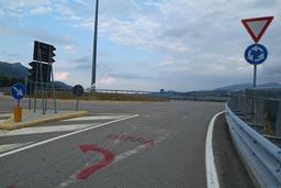 Round about, Birra/beer marked on ground and a big red arrow marking.