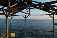 A wooden shed in Twilight. Blue sky and sea, Greece.