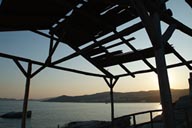 Blue sea, rocks and a shed, Greece. Kavala