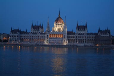 Budapest lit parliament at night, Danube in front.