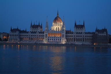 Budapest lit parliament at night, Danube in front.