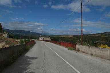 Road to Aliano in Basilicata, blue sky, bridge, telegraph pole.