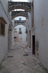 Locorotondo, centro storico, narrow street, arches.