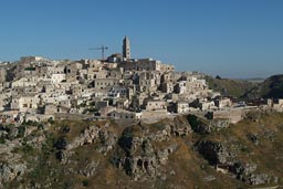 Matera in Basilicata, from other side, crane on top next to cathedral.