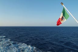 Ferry Trapani Sicily, Cagliary Sardinia, Italian Flag and Blue sea and sky.