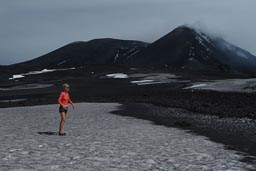 Mount Etna, snow on top of 2,900m, girl in hotpants and sandals.