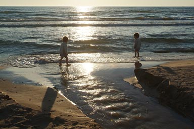 Beach and sunreflection, late, boys.