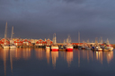 Norway, Bodo, red ships in midnight sun light.