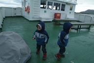 Twins on ferry boat ride Norway.